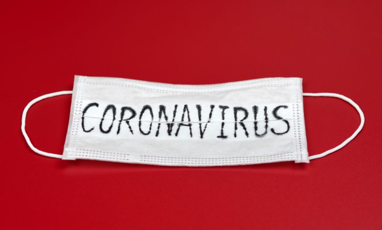 Mask displays coronavirus text.