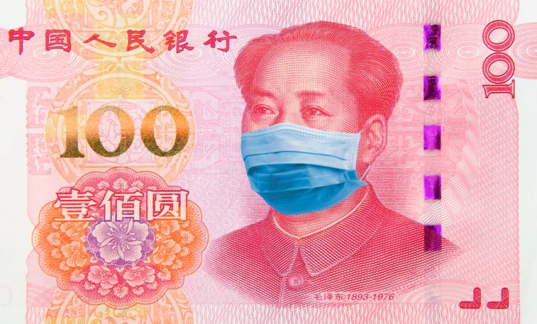 Photo of Chinese Currency with Mao wearing a protective mask.