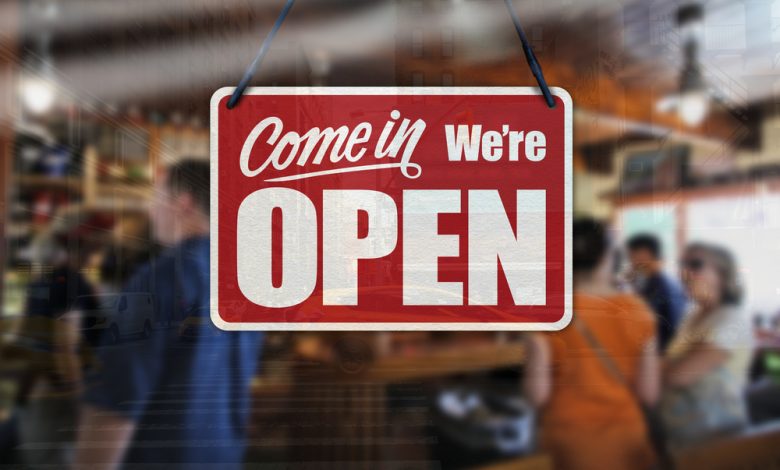 Image of business sign saying "Come in we're open."