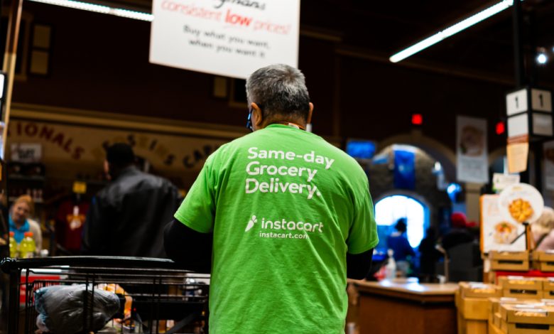 Instacart shopper picking up groceries.