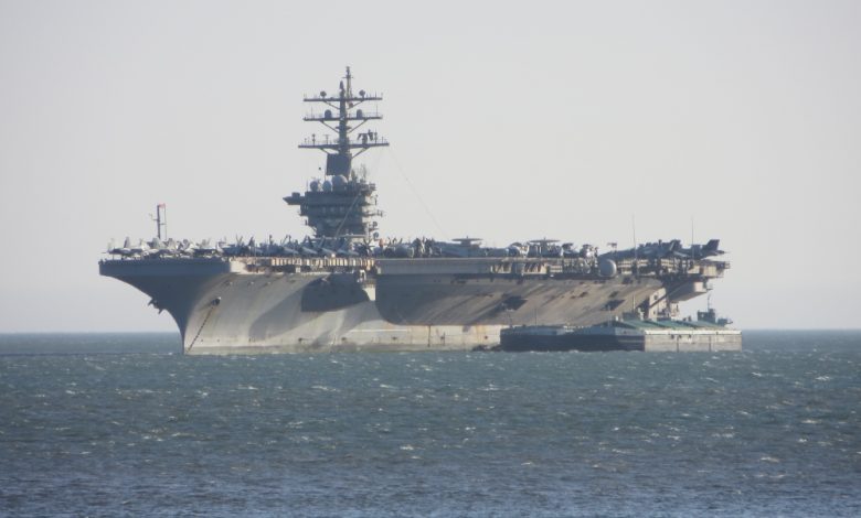 Image of American aircraft carrier at sea.