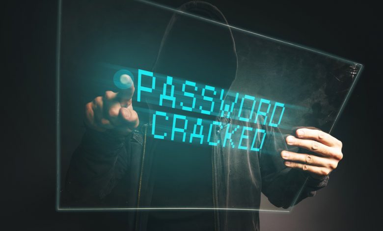 Image of hacker cracking a password with a holographic screen.