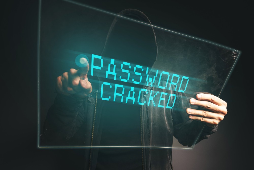 Image of hacker cracking a password with a holographic screen.