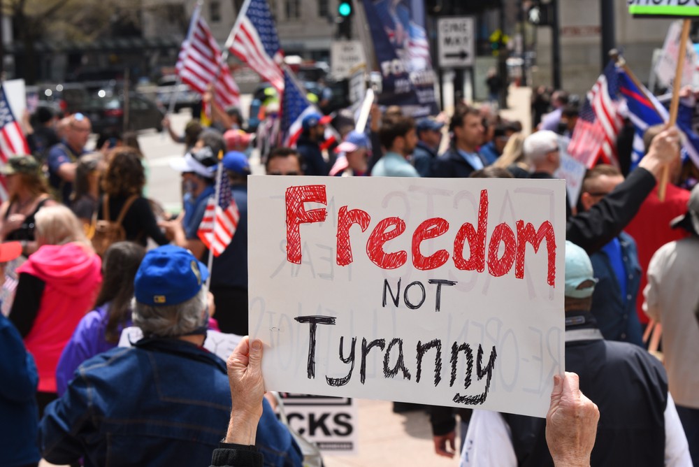 Protesters hold a rally protesting Illinois Governor J.B. Pritzker's stay at home order.