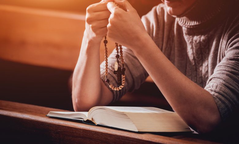 Christian woman praying in church.