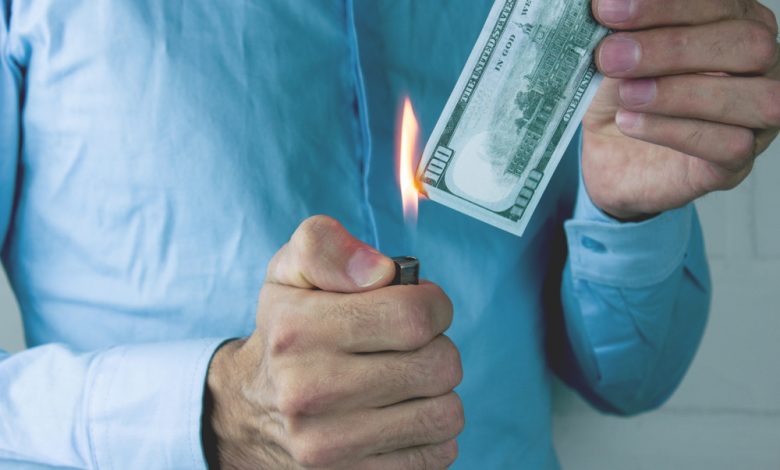 Man burning money.