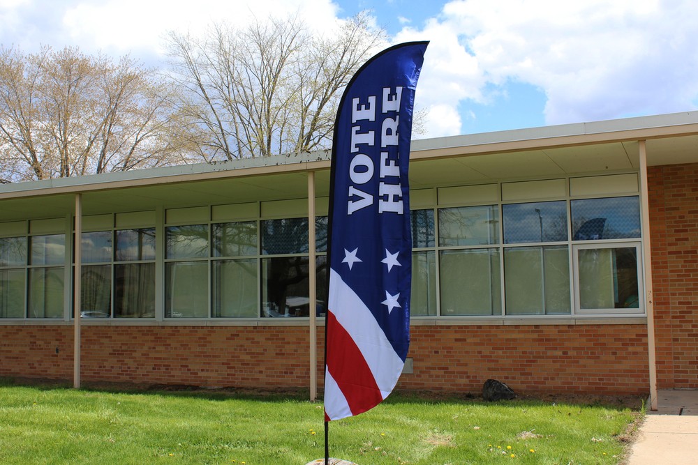 Red white and blue "Vote Here".