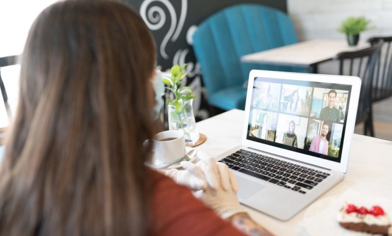 Woman video calling through laptop during coronavirus pandemic lockdown.