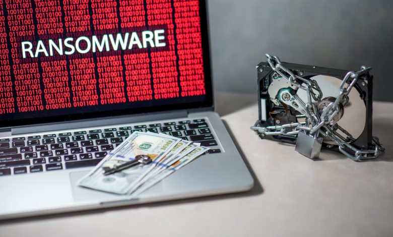 Concept image of ransomware malware showing locked hard drive and computer.