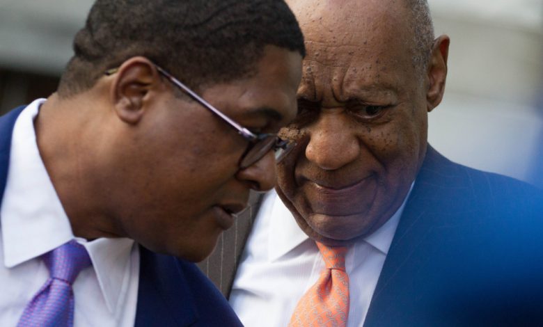 Image of actor Bill Cosby (R) and spokesman Andrew Wyatt.