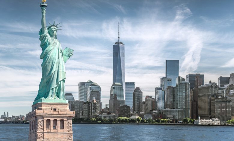 The statue of Liberty with World Trade Center background