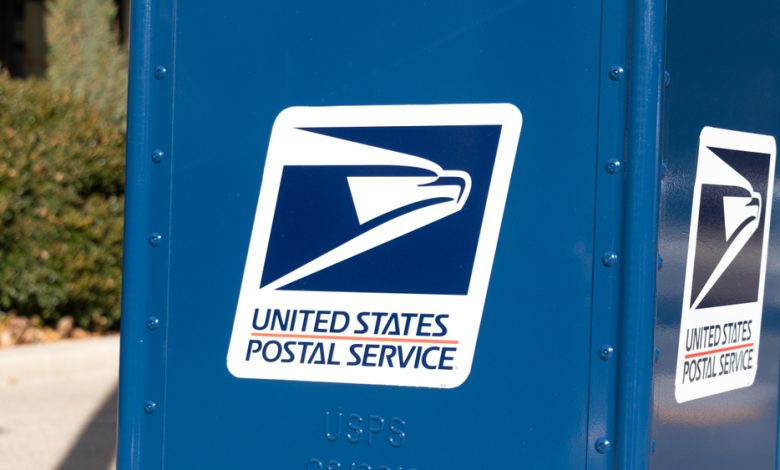 United States Postal Service (USPS) logo on the side of a new drop-box.