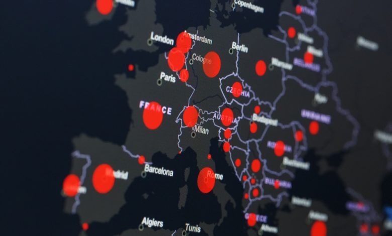 COVID-19 coronavirus pandemic on the map of Europe with red dots representing infection cases.