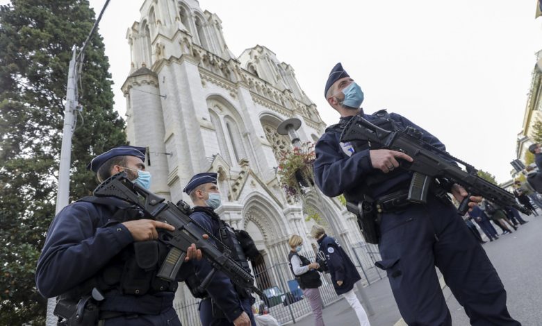 Armed troops guarding a church following the 2020 Nice knife attacks in France.