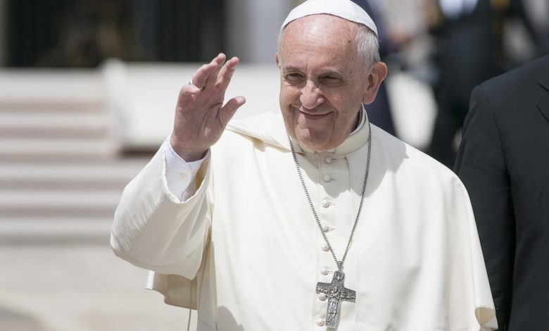 Pope Francis greets the pilgrims during his weekly general audience in St Peter's square at the Vatican.