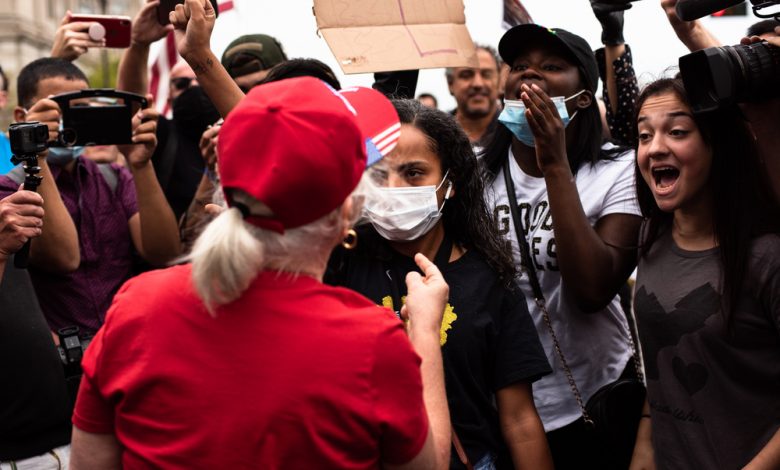 Trump supporter and Anti-Trump mob confronting each other.