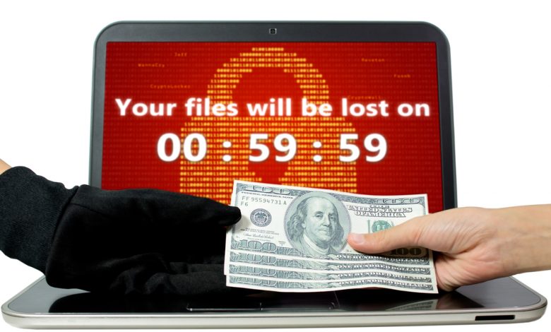 Ransomware concept image showing laptop infected with ransomware with a countdown timer and the victim paying the hacker