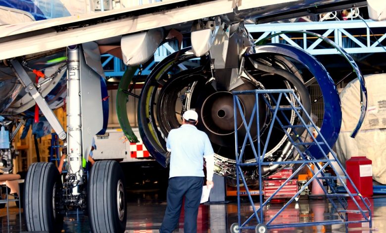 Engine and chassis of a passenger airplane under heavy maintenance.