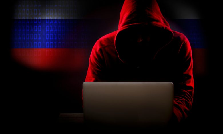 Image of a hooded Russian hacker.