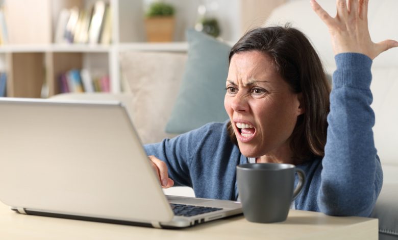 Frustrated women because of her slow computer.