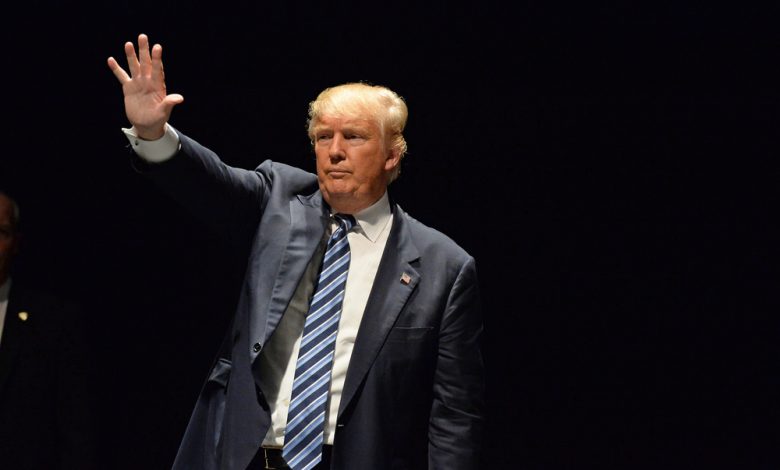 Donald Trump salutes supporters at the Peabody Opera House.
