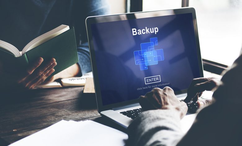 Image of a computer backing up files.