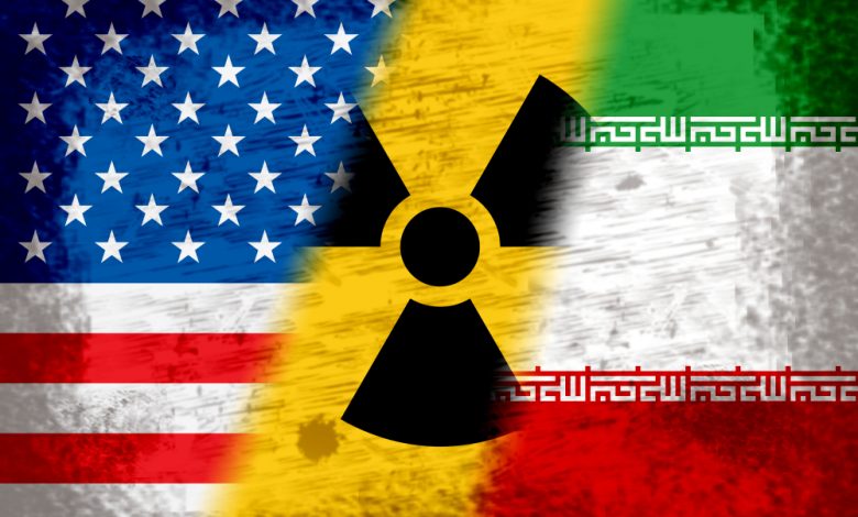 Iran and US flags with a nuclear symbol in between.