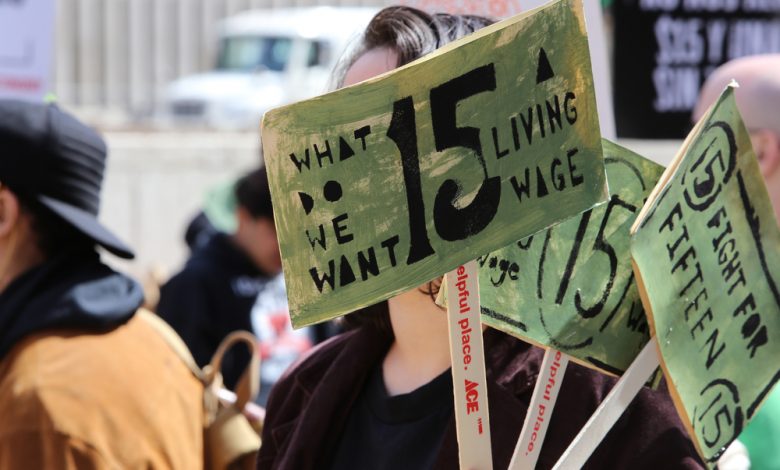 Image of workers in New York demanding an increase in minimum wage.