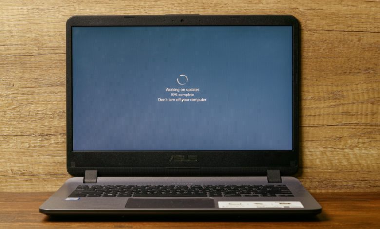 Image of a laptop displaying Windows update on screen.