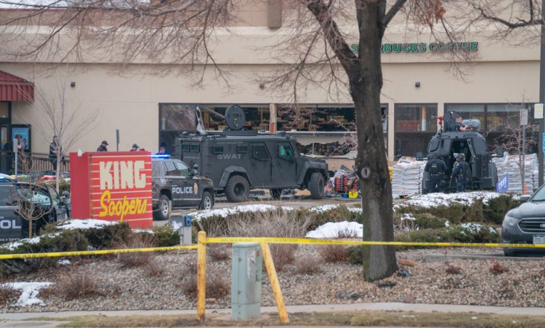 Police and SWAT officer in front of King Soopers.