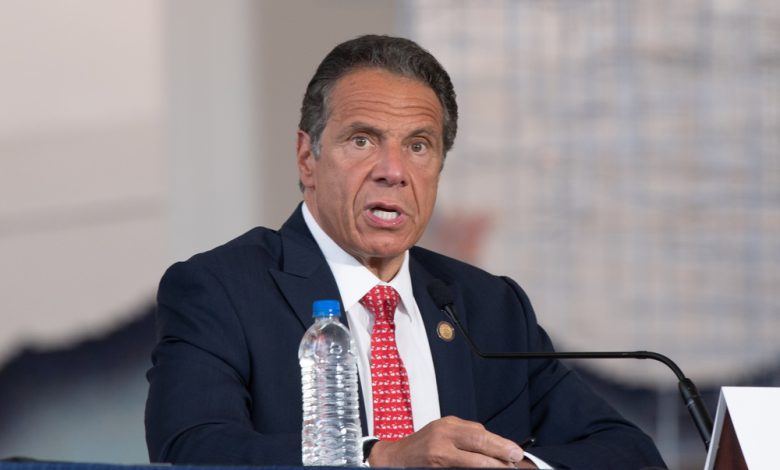 Andrew Cuomo speaking at a conference.
