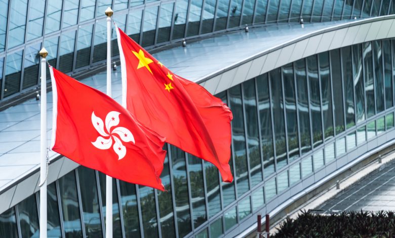 Hong Kong and mainland China national flags.