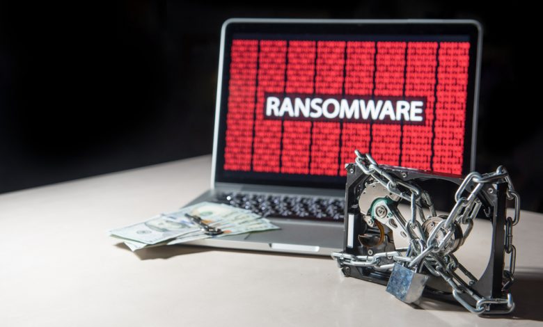 Malware ransomware concept showing an image of an infected computer and a chained hard drive.