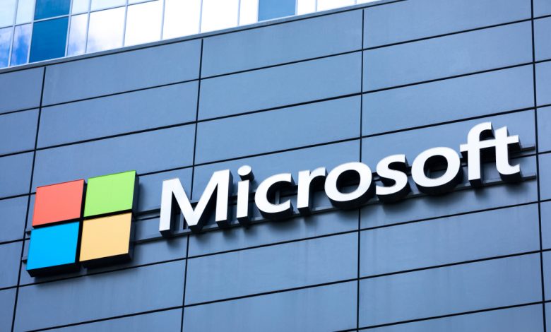 Microsoft logo and sign on the exterior of an office building.