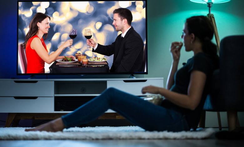 Woman Watching TV On Couch Or Sofa. Watch Television