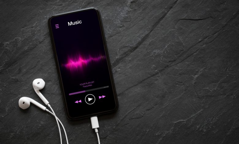 Music player on mobile phone with earphones