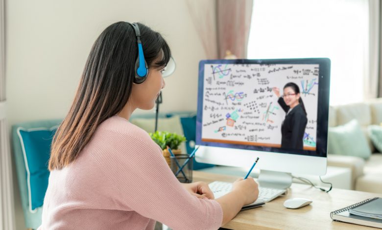 Asian woman student video conference e-learning with teacher on computer.