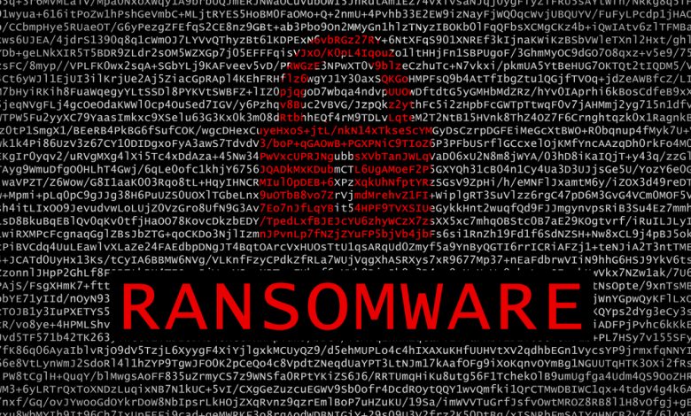 Ransomware text with red lock over encrypted text - cyber crime