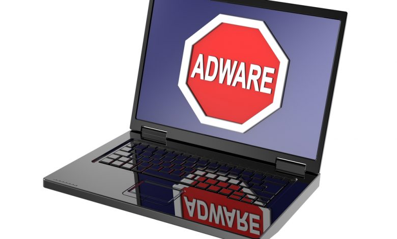 Adware warning sign on laptop screen. Computer generated 3D photo rendering.