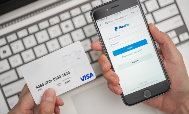 Melbourne, Australia - May 10, 2016: Using PayPal and credit card for online shopping. PayPal is a worldwide online payment system and one of the most popular ways of making payment on the Internet.