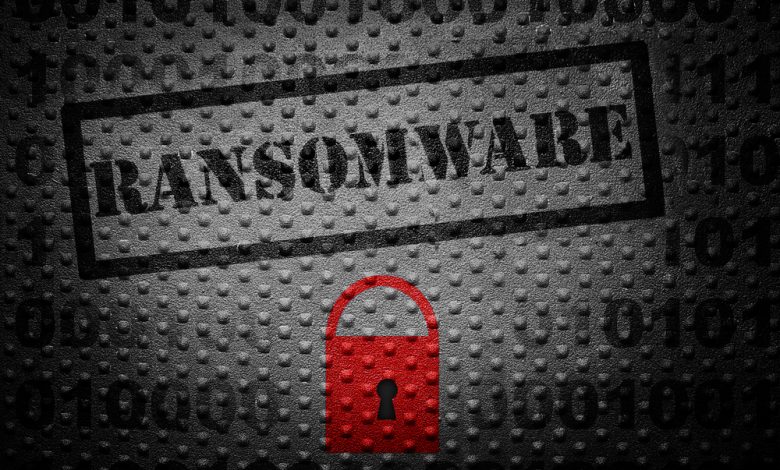 Ransomware text with red lock -- cyber crime concept