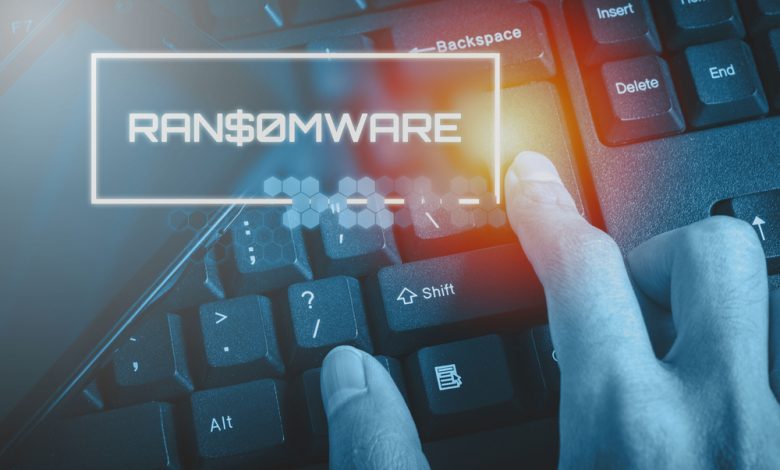 Technology concept showing RANSOMWARE while the finger pressed button on the keyboard.