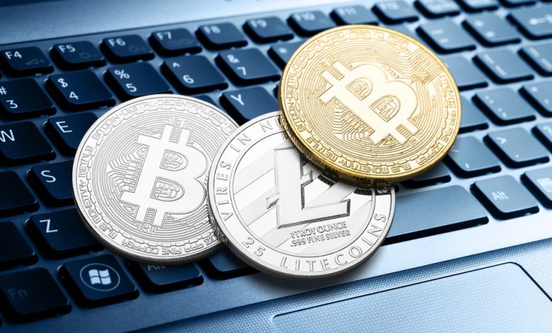 Many bitcoin coins on a laptop keyboard