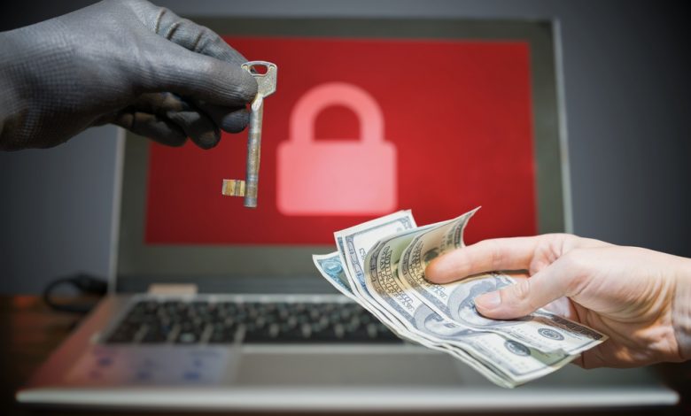 Computer security and extortion concept. Ransomware virus has encrypted data in laptop. Hacker is offering key to unlock encrypted data for money.