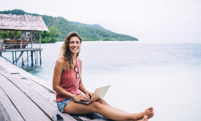Woman working remotely on an island.