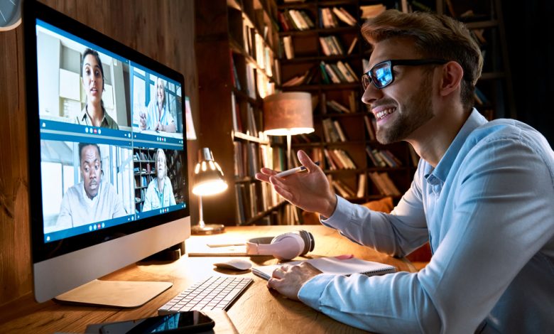 Business man having virtual team meeting on video conference call using computer.