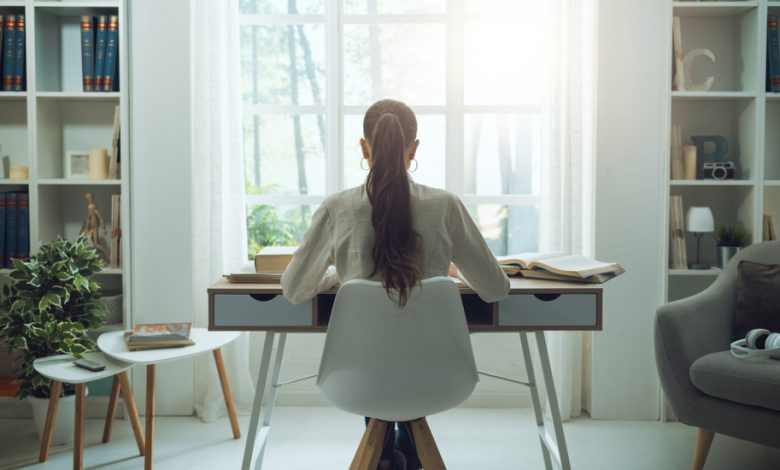 Image of a woman working on her computer productively.