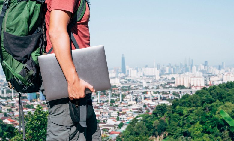 digital nomad traveling with his laptop.