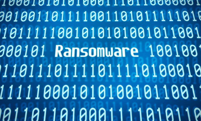 the word ransomware surrounded by binary code.