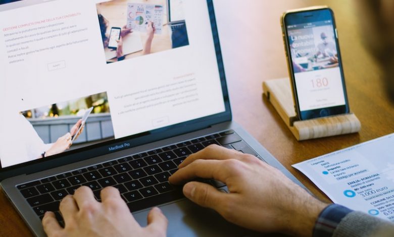 selective focus photography of person using black laptop computer